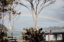 A rainbow spans Sydney Harbour before a wedding