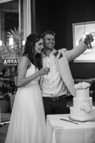 A couple propose a toast to the guests during the reception